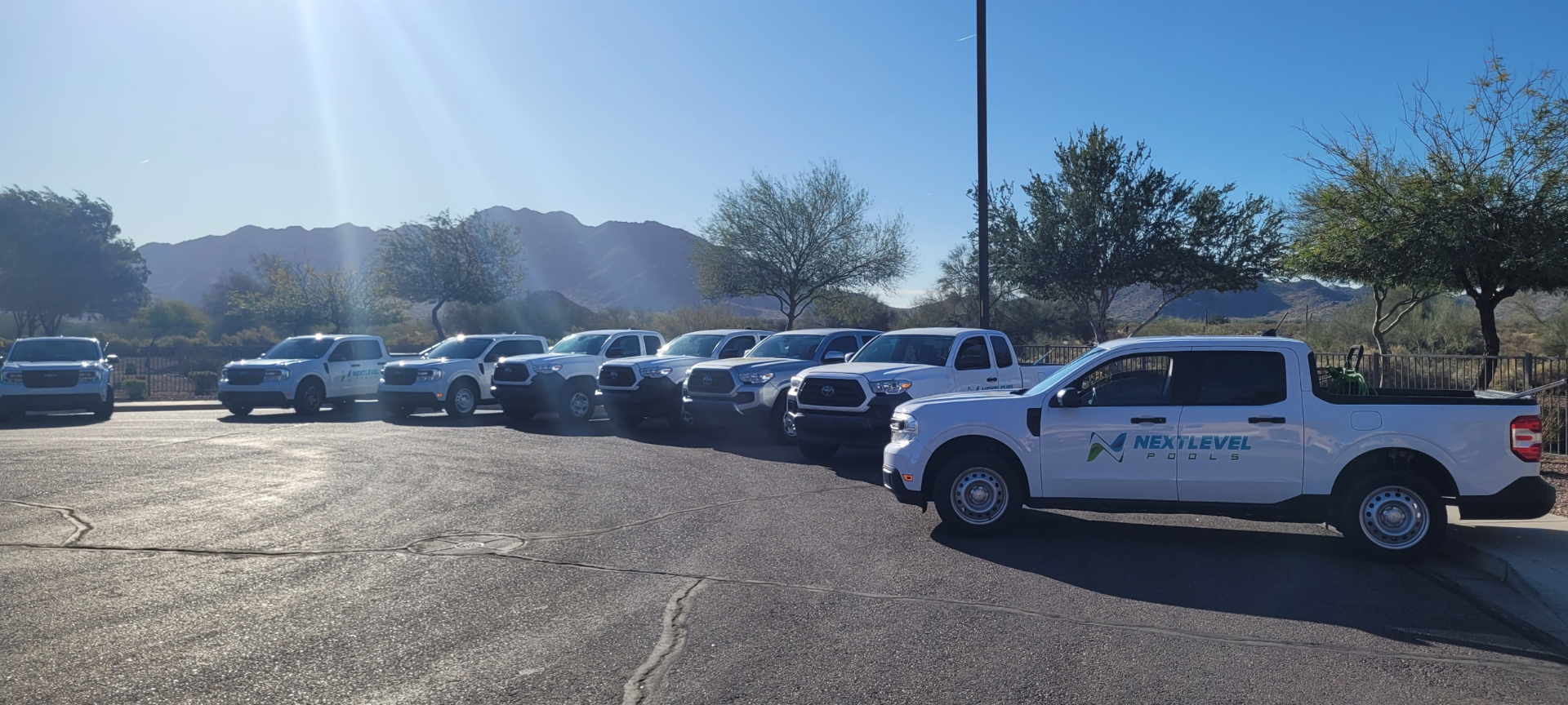 Next Level Pools fleet of service trucks